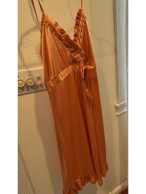 Orange satin slip dress with ruffles and tie back #slipdress #satin #feminine